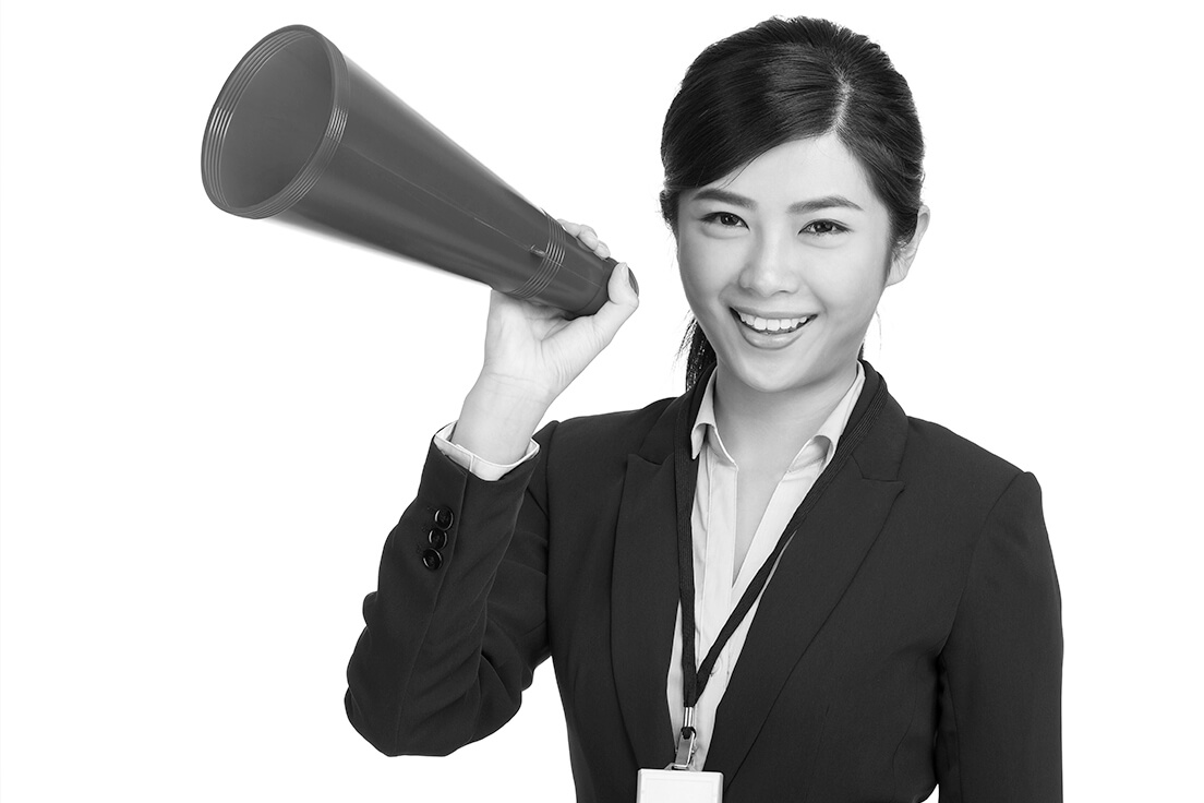 Business woman holding a megaphone