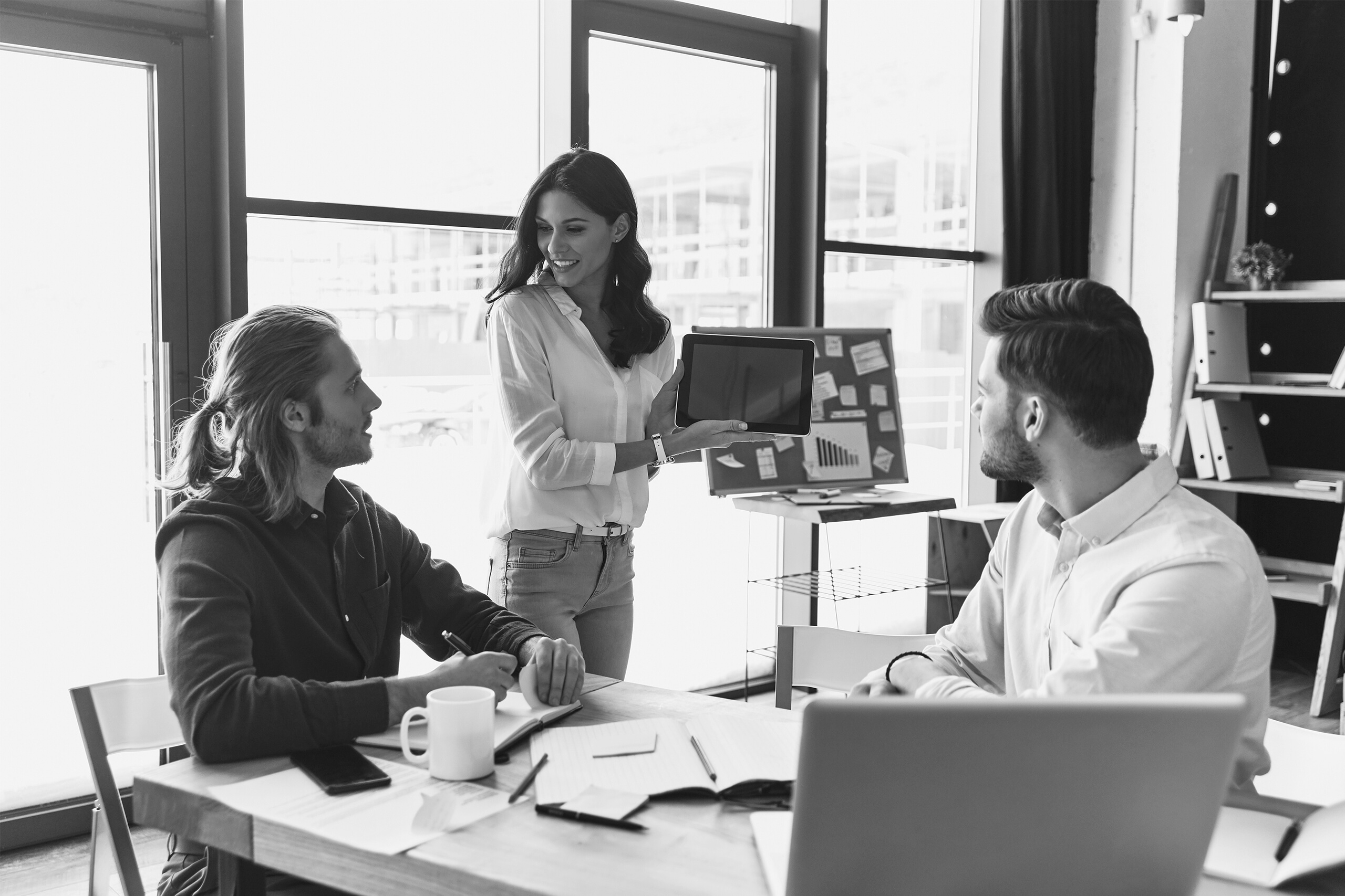 Businesswoman presenting her ideas to her team